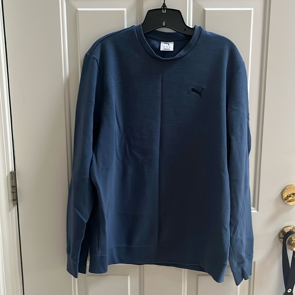 Puma ribbed Crew neck, cuffed sleeves, banded bottom.  Fits smaller than a large